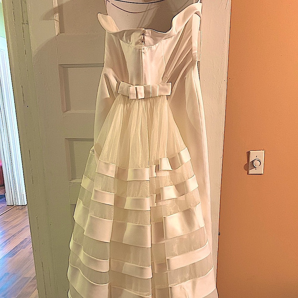 Wedding dress with satin stripes on train